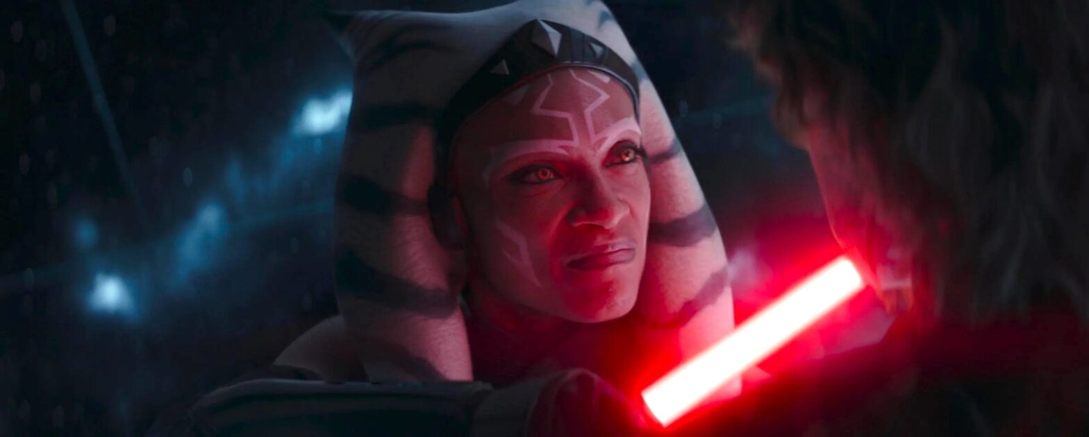 Ahsoka Tano faces down Anakin Skywalker, holding his red lightsaber to his throat, her eyes turning Sith-yellow.