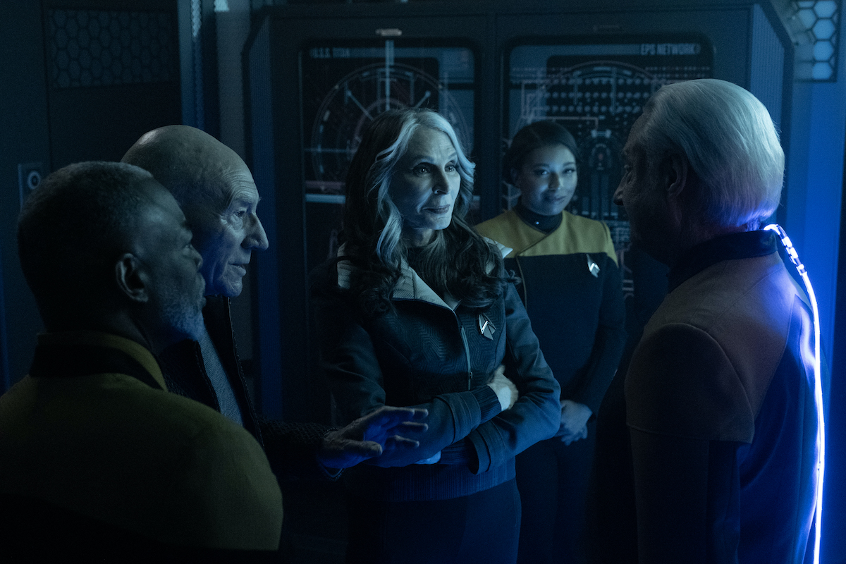 Geordi, Picard, Dr. Crusher, and Allandra look on happily as Data emerges from his mental duel with Lore.